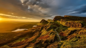 Breathtaking Sunset Over the Scenic Hills and Mountains of Scotland