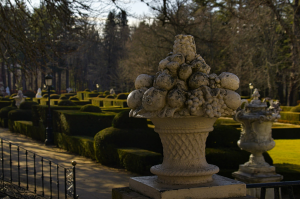 Decorative Stone Urn Adorned with Sculpted Fruits in the Gorgeous Gardens of Granja de San Ildefonso, Segovia