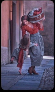 Nostalgic Moments in a Traditional Alleyway: A Woman and Child's Playful Interaction