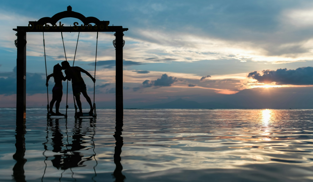 Romantic Sunset: Dancing on a Water Swing