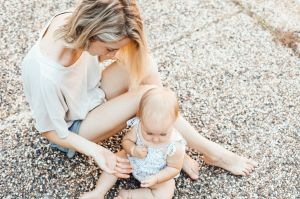 Summer Moments: A Woman and a Baby Enjoying Outdoor Leisure Time