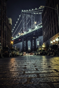 The Manhattan Bridge Illuminated: A Nighttime Jewel in Urban Atmosphere