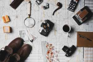 The Vintage Adventure Plan: A Flat Lay Arrangement of Travel Essentials